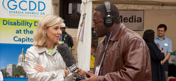 GCDD Deputy Director being interviewed by a reported at Disability Day